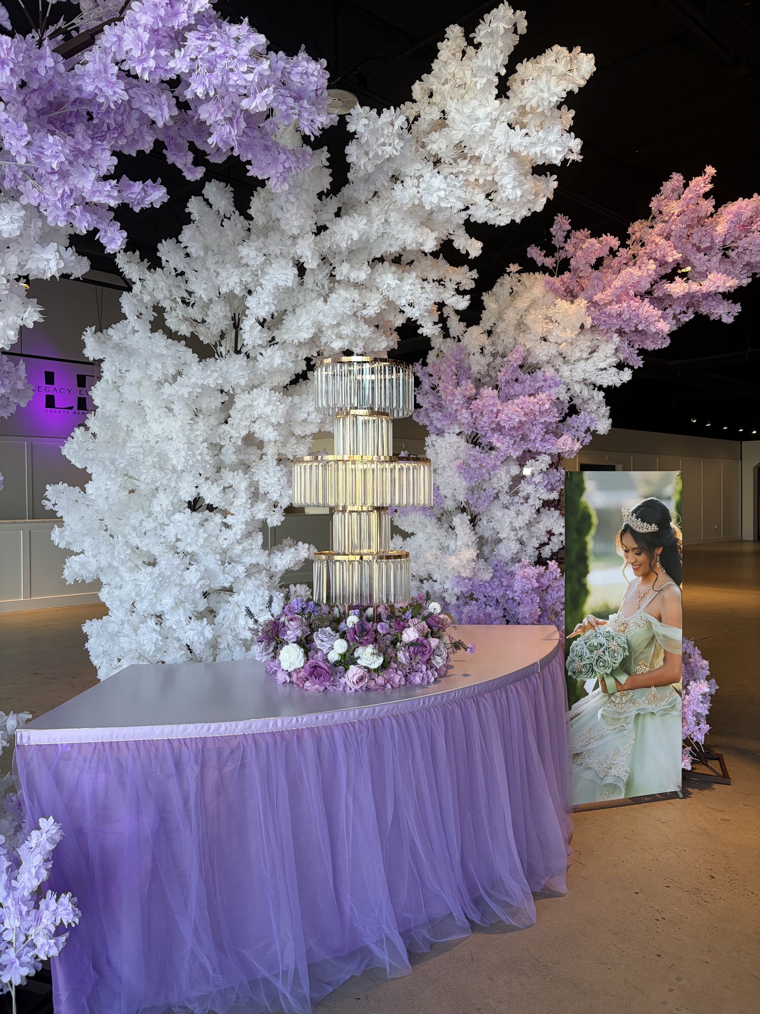 Overhead view of blush floral centerpiece and pink glassware in Pasco event venue